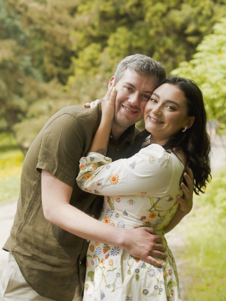 Couple embracing under a blossoming tree